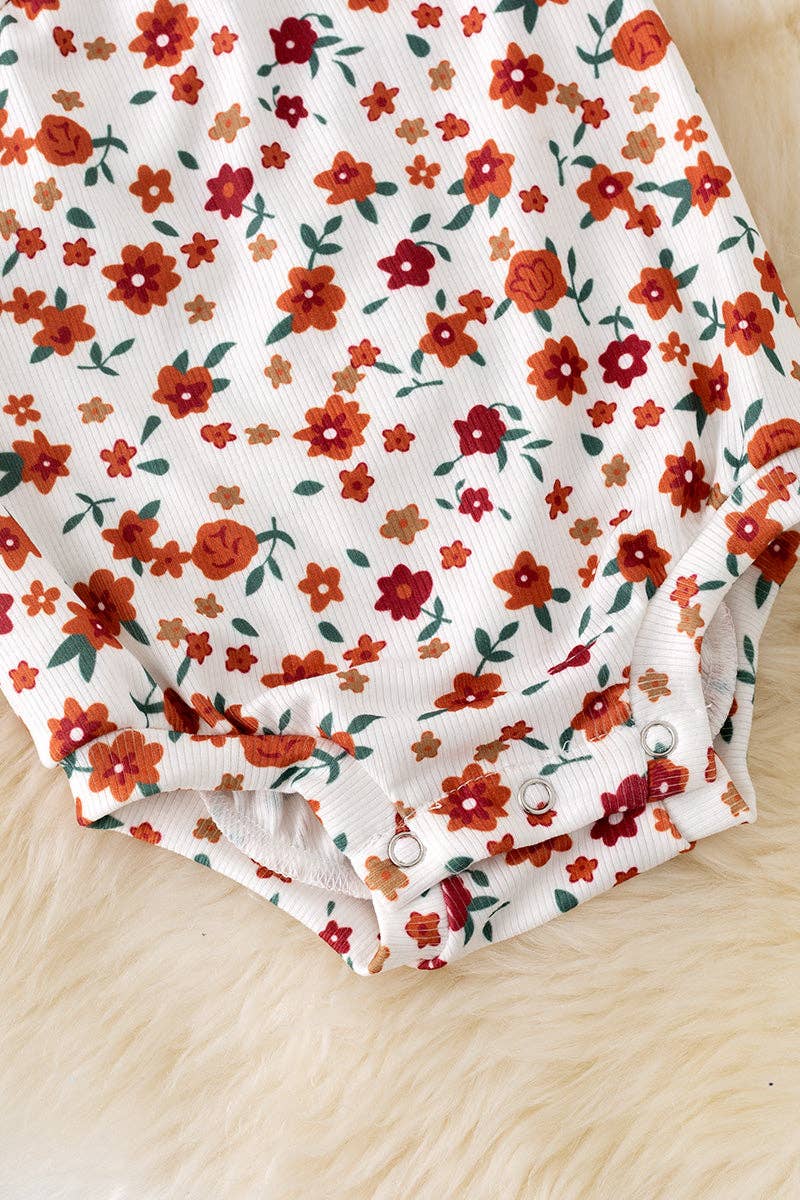 Cold shoulder ditsy floral bodysuit with snaps. RPG50974 AMY: 2T